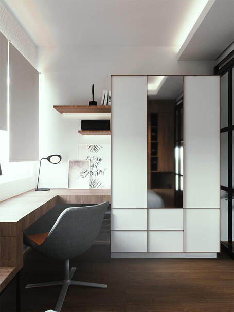 A nook is transformed into corner office space next to the wardrobe.