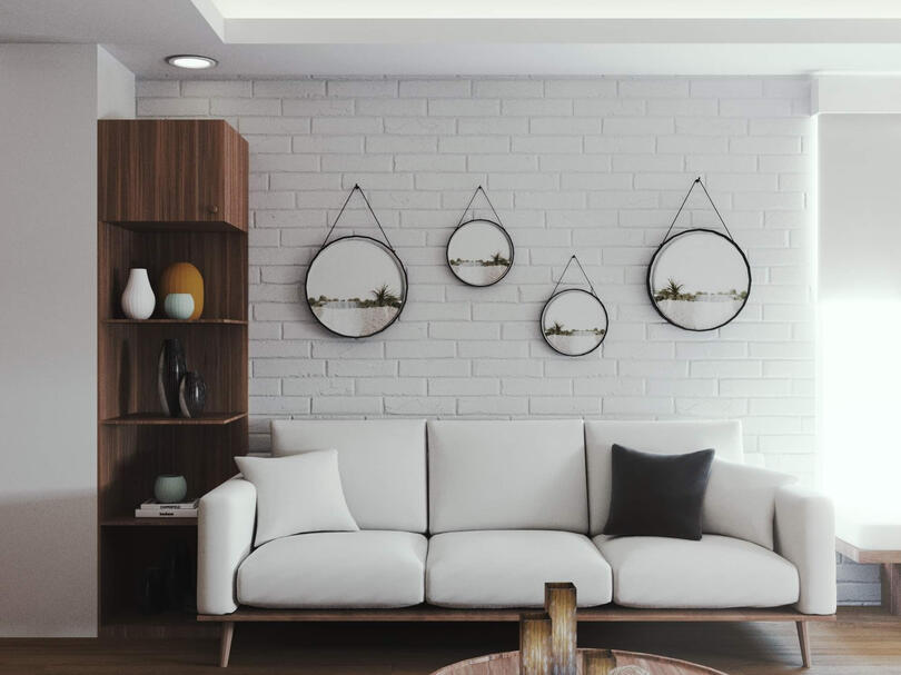 In the living area, wooden planks form floating shelves and the corner is fit with a four-seater dining set to cozy up the space